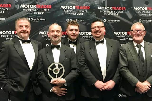 Some of the team from Just Nice Clean Cars in Warwick with the award. Photo supplied
