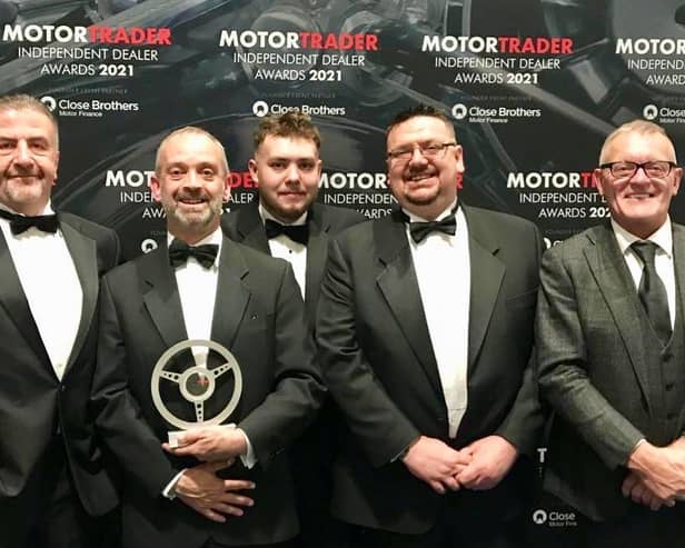 Some of the team from Just Nice Clean Cars in Warwick with the award. Photo supplied