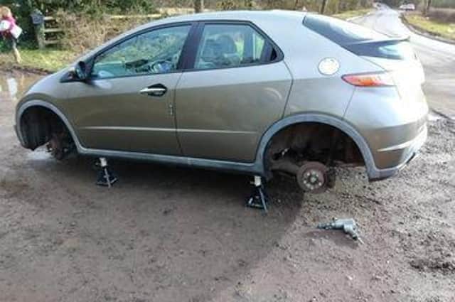 Sam Khan's car after he had driven through the pothole in the Welsh Road between Leamington and Southam in February.