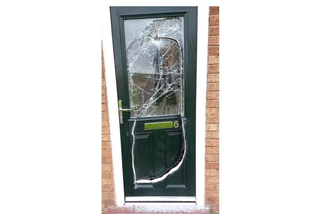 The door was smashed during the raid.