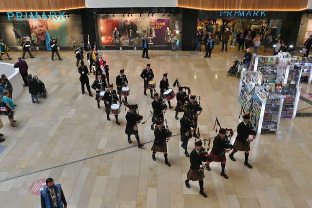 The Poppy Appeal 100th Anniversary launch by The Royal British Legion Peterborough Branch with a march from the war memorial to Queensgate Shopping Centre where members of the Peterborough Highland Pipe Band led the procession EMN-211029-133312009