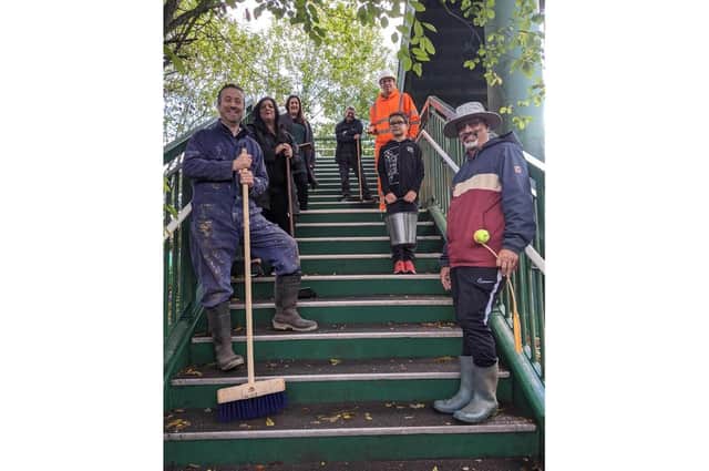 Cllr Jacques with the other members of the community who rallied to help clean the footbridge. Photo supplied
