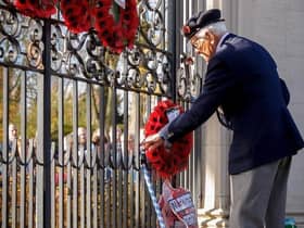 A Rugby veteran lays a wreath at the Memorial Gates during a previous year's ceremony.