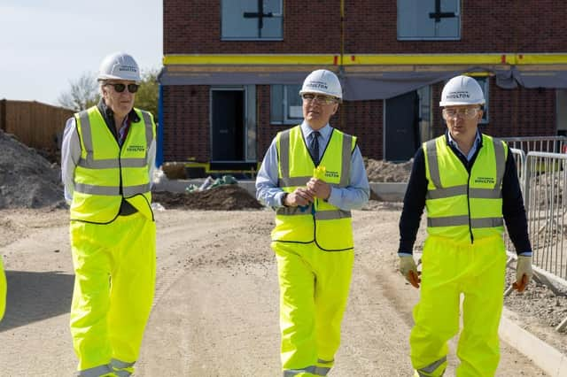 Mr Pawsey (centre) with Richard Coppell (right) and Nigel Hugill (left) of Urban&Civic at Houlton.