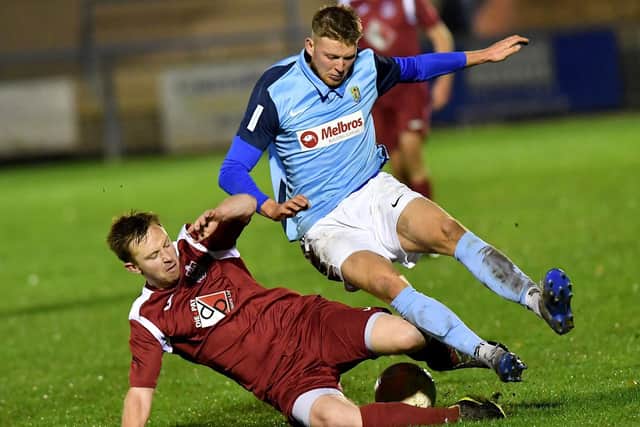 Alex Lock chopped down in Rugby Town's game with Long Buckby