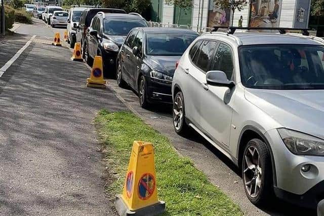 Cars line Juno Drive near the megalab in Leamington where motorists removed cones creating a 'parking blackspot'. Photo by Leamington Police.