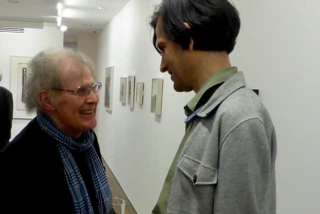 Simon Lewty in 2016 at his gallery, Art First, London,  with writer and poet Ian Hunt (author of the 2016 Leamington Spa Art Gallery & Museum essay for the survey exhibition, The SIGNificance of Writing) photo by Clare Cooper.