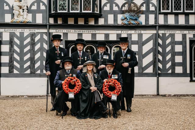 The current Brethren in uniform outside the Lord Leycester Hospital in Warwick.