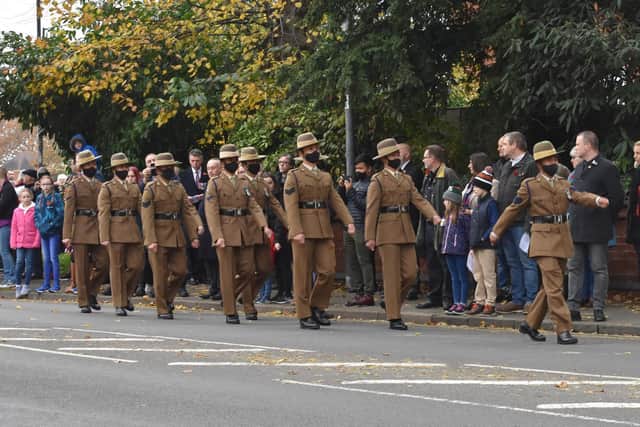 Men of  250 Squadron of the Queen's Gurkha Signals march away at the end of the ceremony.