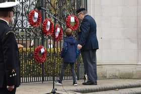 Royal Artillery veteran Martin and Grandson Theo lay a wreath at the gates.