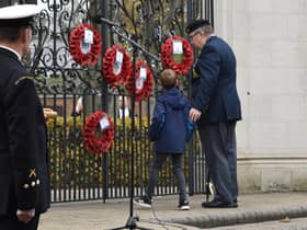 Royal Artillery veteran Martin and Grandson Theo lay a wreath at the gates.