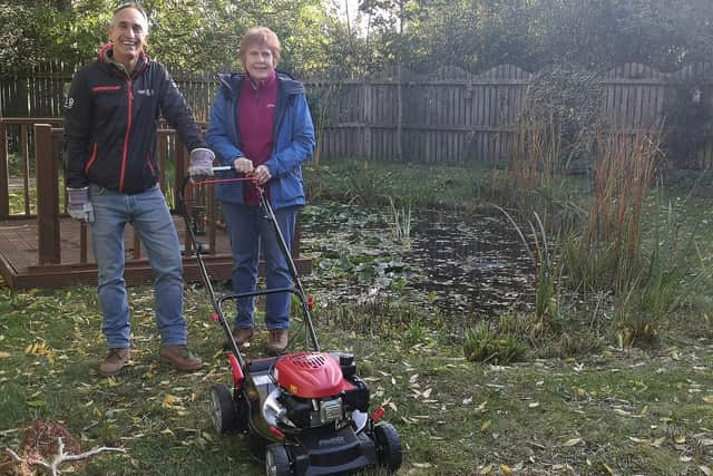 Bridgetone's Andrea Manenti presents the new mower to Elizabeth Phillips MBE.