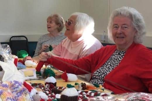 Some of The Gap's 'knit 'n natterers' members making gifts to sell. Photo supplied