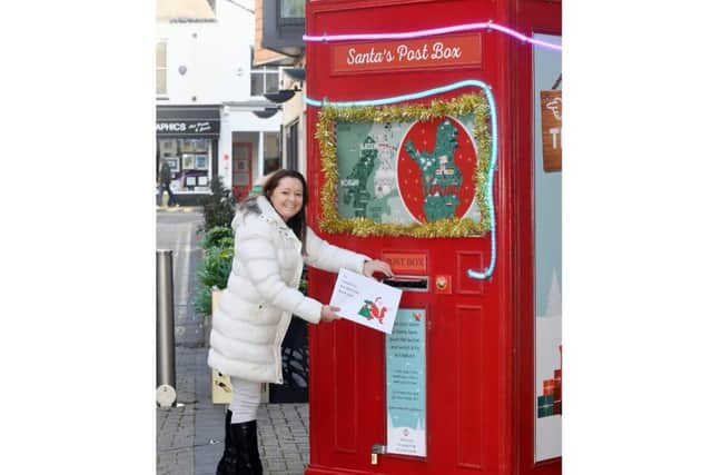 Stephanie Kerr next to Santa’s Postbox in Leamington town centre. Photo supplied