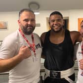 Cleary’s heavyweight Joe Bourne (centre) with coaches Johnny Biddle, and Tom Kelly at Saturday evening’s home show