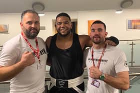 Cleary’s heavyweight Joe Bourne (centre) with coaches Johnny Biddle, and Tom Kelly at Saturday evening’s home show