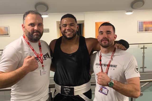 Cleary’s heavyweight Joe Bourne (centre) with coaches Johnny Biddle, and Tom Kelly at Saturday evening’s home show