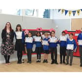 Rugby MP Mark Pawsey (right) with the head and deputy head boys and girls, along with the other pupils who volunteered for the and Long Lawford Primary School head Mrs Stringer (left)