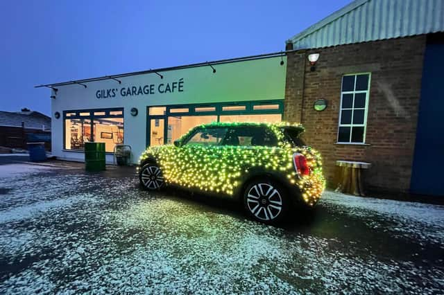 Nicholas ’Nico’ Martin and his festive MINI Electric car made a stop at Gilks' Garage Cafe for its Christmas market on Sunday November 28 (Submitted photo)