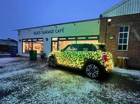 Nicholas ’Nico’ Martin and his festive MINI Electric car made a stop at Gilks' Garage Cafe for its Christmas market on Sunday November 28 (Submitted photo)