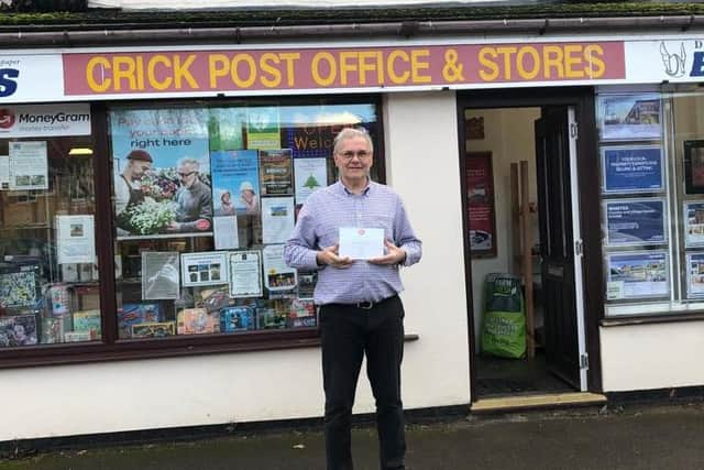 Chris outside Crick Post Office, where he has worked for 30 years.