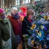 Gayle Harris, Janet Ball and Sandra Maclellan enjoying the Christmas tree festival in St Mary's Church