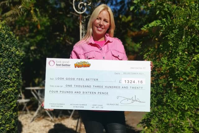 Sarah Addis from the Look Good Feel Better Charity charity is pictured holding the cheque for £1,320 and a certificate of thanks it sent to the event organisers of the Cubbington Fun Day event in the summer.