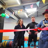 Olivia Kreigenfeld and Martin Browne, of Physical Formula, watch on as Leamington Mayor Cllr Susan Rasmussen officially opens their new gym.