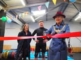 Olivia Kreigenfeld and Martin Browne, of Physical Formula, watch on as Leamington Mayor Cllr Susan Rasmussen officially opens their new gym.