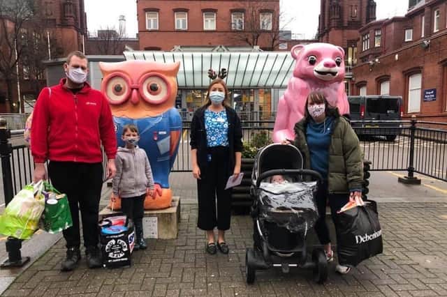 Left to right: Andrew Bowell, Noah-Jake Bowell, Maria from the family liasion at the PICU ward at Birmingham Children's Hospital, Delilah-Grace in the pushchair and Michelle Lawley when they were handing over donations for the family room in 2020. Photo supplied