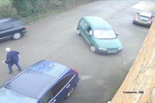 CCTV picture shows the camp site warden's van with smashed windows as the getaway car speeds off. It has an orange LED beacon on the roof. The corner of the smashed red VW Polo is just visible on the left.