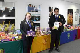 Avon Valley pupils with the four tables of donations.