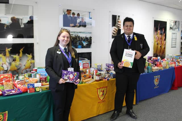 Avon Valley pupils with the four tables of donations.