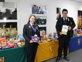 Avon Valley pupils with the four tables of donations.