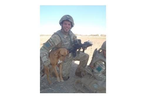 Pte Conrad Lewis with his dog Pegasus, also known as 'Peg'.