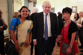 Two carers at Kineton Manor Nursing Home thanked for their Covid-19 pandemic service during meeting with Prime Minister (Pictured: Kineton carer Tintu Tom, Prime Minister Boris Johnson and Kineton Carer Kitty Chen.)