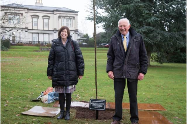 Castel Froma chief executive Marie Bawden and chair of trustees John Evison stand next to the newly planted tree and plaque at Lillington House. Photo supplied
