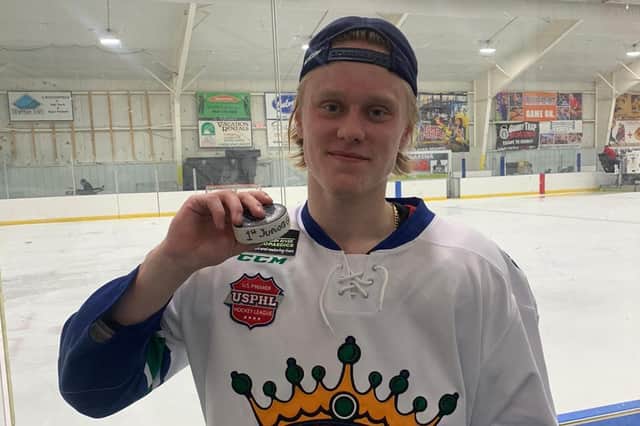 Rhodes Mitchell-King with the traditional puck for his first Junior goal with the Wisconsin Rapids Riverkings
