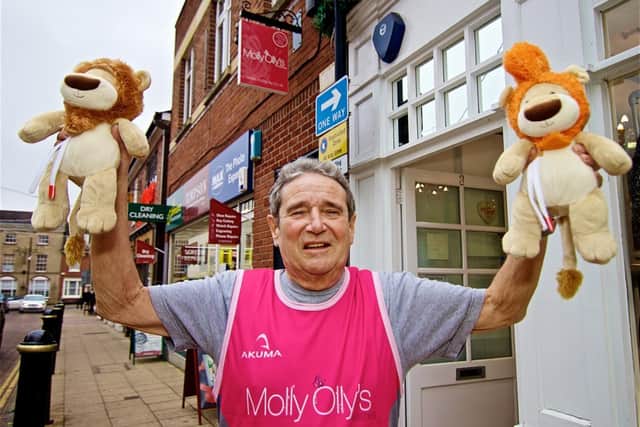 Tony Cunningham outside the Molly Olly's Wishes offices in Warwick with Olly The Braves. Photo supplied