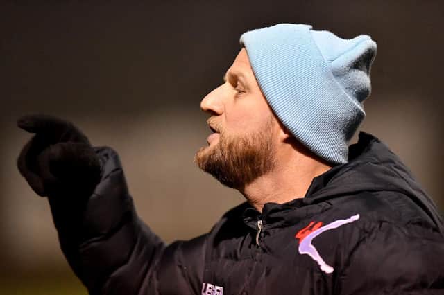 Rugby Town manager Carl Adams urging on the 10 men against Lutterworth
