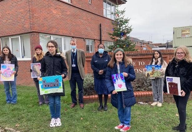 Left to right: Diana Truchanova, Aylesford School, Layla Payne, Aylesford School, Matilda Long, North Leamington School, Felicity Richards. North Leamington School, Betty La Barbera, North Leamington School, Maisie Hotten, Aylesford School with members of staff from the ward at Warwick Hospital. Photo supplied