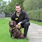 James  Sowerby is pictured at Dogs Trust Kenilworth with Spaniel Cross, Suede, one of the many dogs his fundraising efforts will help.
