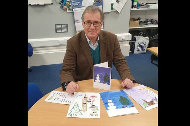 Mark Pawsey displays some of his favourite Christmas cards sent in as part of his Christmas card competition.