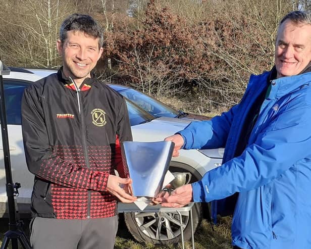 Octavian Droobers club captain Alistair Powell receiving New Years Day Trophy from Richard Lewis chairman West Midlands Orienteering Association
