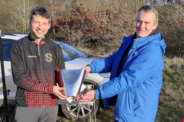 Octavian Droobers club captain Alistair Powell receiving New Years Day Trophy from Richard Lewis chairman West Midlands Orienteering Association