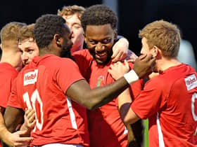 Jamal Clarke is mobbed after heading in Rugby Town’s second goal against Coventry Sphinx     PICTURE BY MARTIN PULLEY