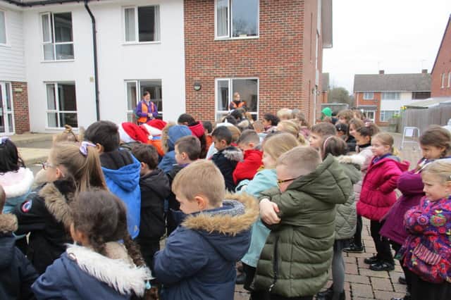Year 2 pupils from Briar Hill Infant School in Whitnash, singing to residents at Cherry Tree Lodge retirement home. Photo supplied