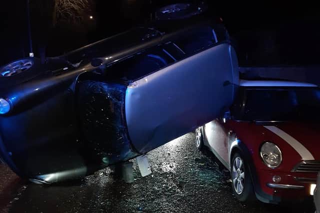 A drink driver in Rugby crashed her Mini into a a row of parked cars in Clifton Road and then hit an oncoming car before flipping the vehicle over onto its side.