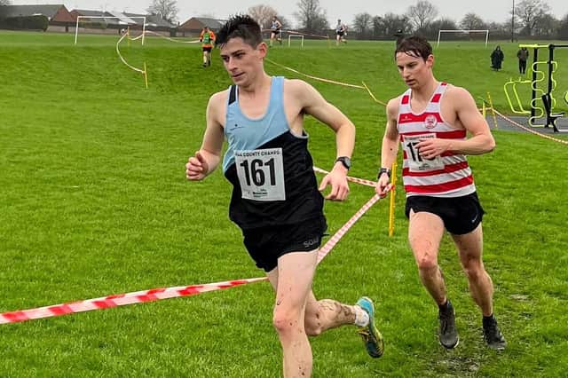 Senior men's winner Haydn Arnall on his way to victory at the Northants Cross Country Championships ahead of runner-up Fynn Batkin of Kettering
