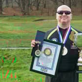 Paddy Doyle celebrating his 700-feat success at the finish at Atherstone Golf Club